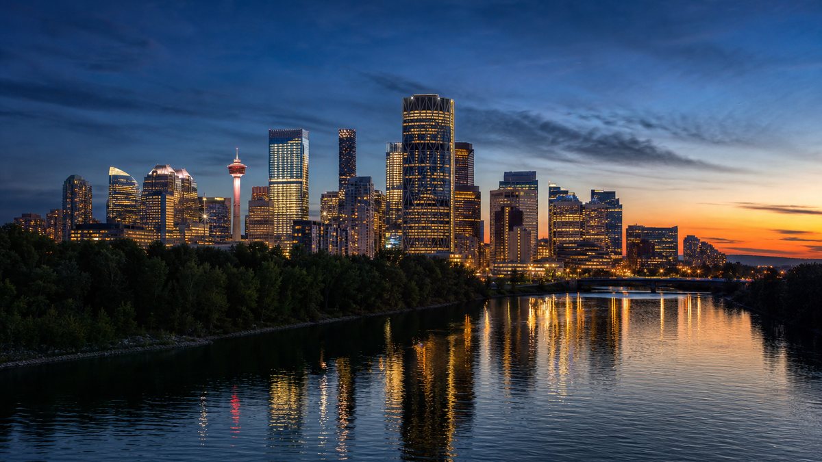 Calgary skyline reflected in the Bow River at dusk, illustrating a major operator registering for Alberta